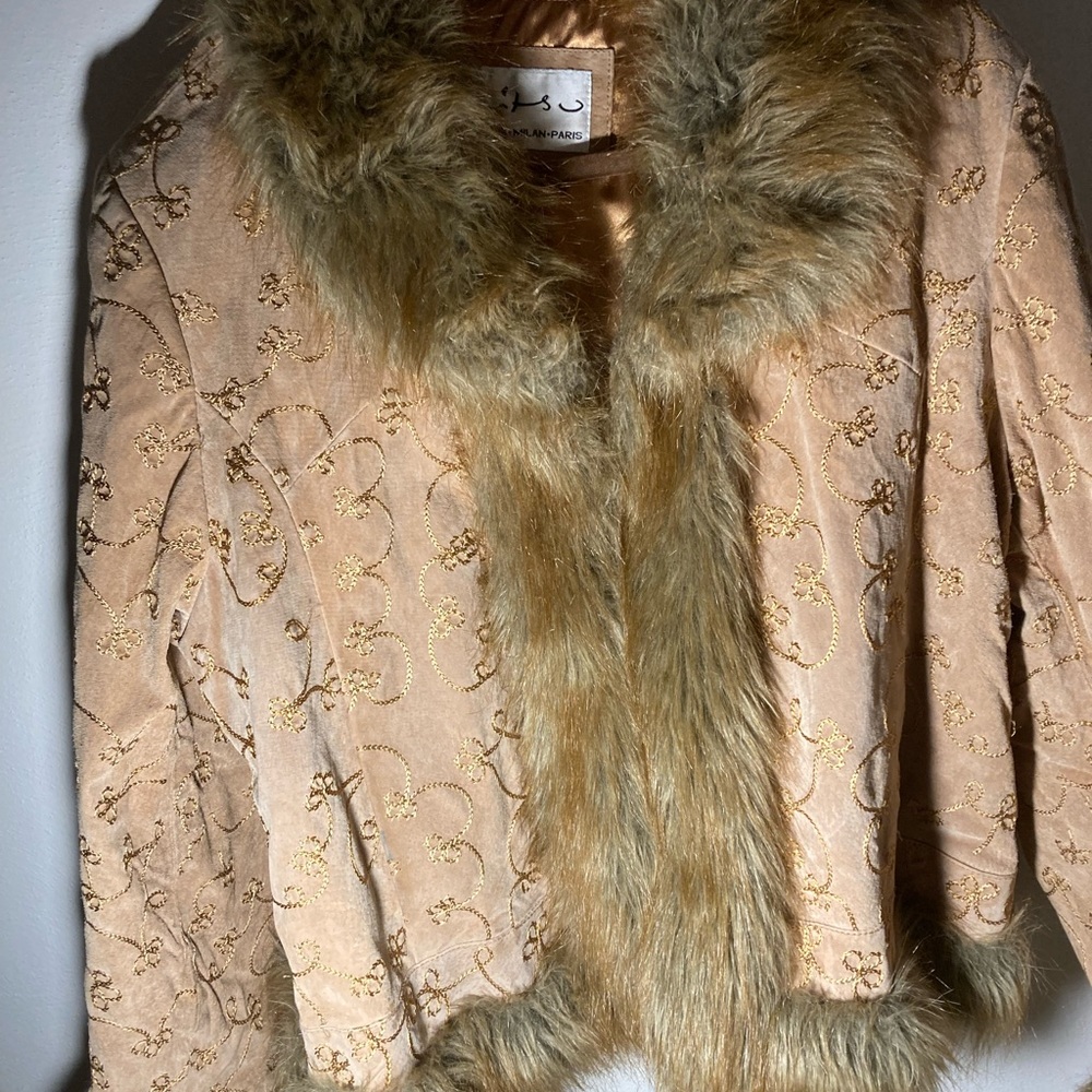 Ladies leather jacket with faux fur trim.